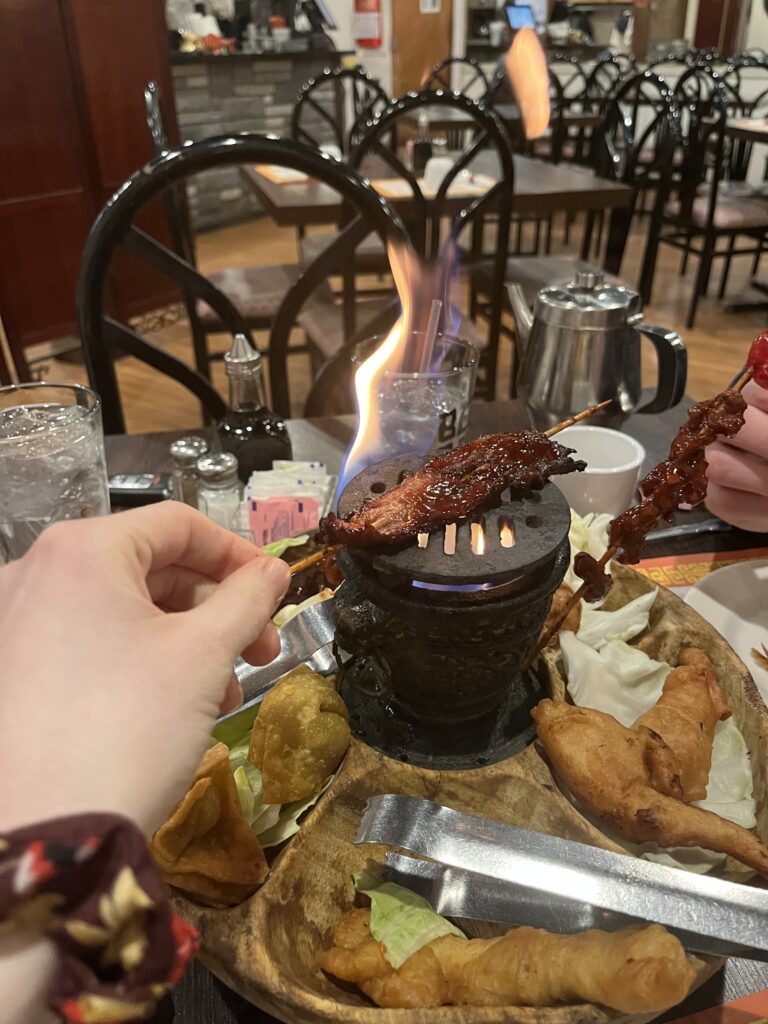 The korean BBQ meat is cooked over the mini fire of the pu pu platter.
