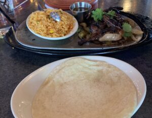Photo of fresh pressed tortillas rice and quail.