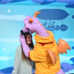Figment admires Bri's mickey ears.