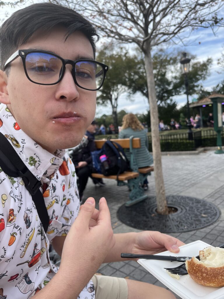Alix looks at camera with cheese all over his face.