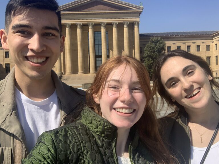 Selfie of Bri, her boyfriend Alix, and her best friend Megan in front of the Philadelphia Museum of Art.