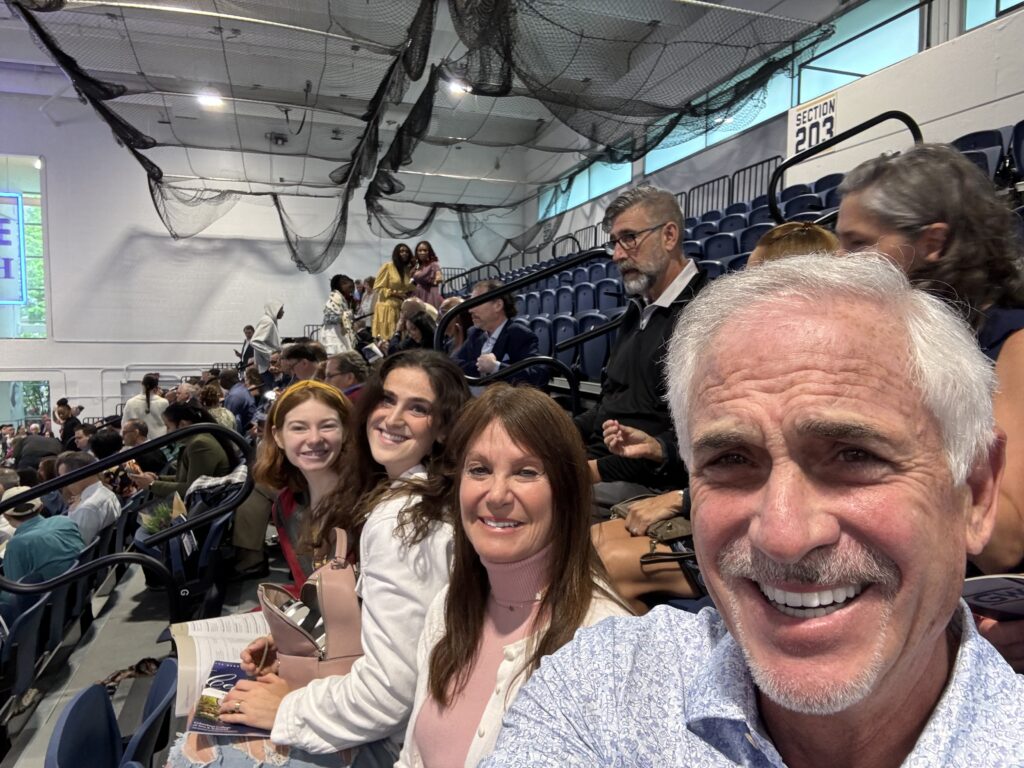 Selfie of Flynn family (Tim, Annette, then Erin Megan's sister) and Bri at a stadium.