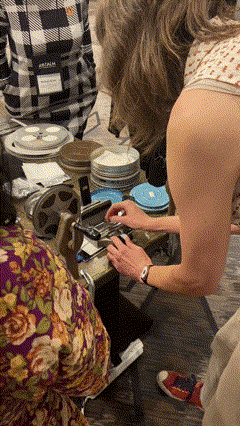 Splicing old motion picture film.